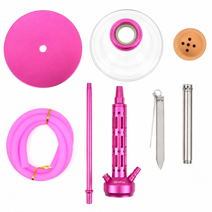 A pink hookah set laid out on a white background, including a round pink mouthpiece, a clear glass bowl with a pink rim, a tan paper filter, a coiled pink hose, a pink metal water pipe body, a long pink stem, two silver metal tubes, and a small metal tool.