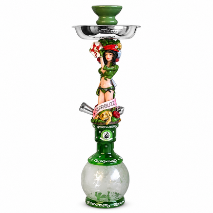 A green hookah with a glossy green ceramic base, a clear glass bowl, a silver metal tray, and a decorative figurine of a woman holding a cigarette on the stem. The stem features colorful floral and fruit details, including a pink sign that reads &