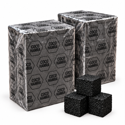 Two Coco Hamra natural coconut charcoal 1kg plastic-wrapped packs, 25mm cubes, 144 cubes total, with three loose charcoal cubes on a white background
