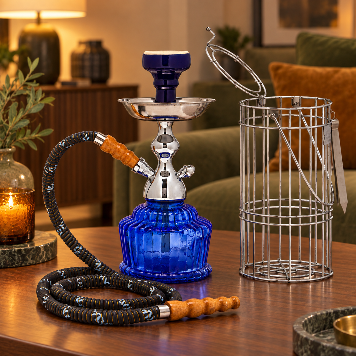 Dark blue MYA QT hookah and silver carrying cage in a warm home lounge setting