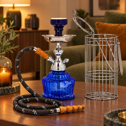 Dark blue MYA QT hookah and silver carrying cage in a warm home lounge setting